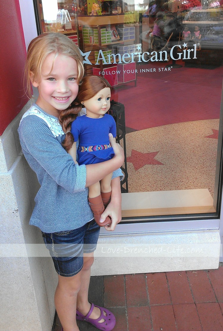 Anna and Saige, a doll she bought with her own money last August. 
